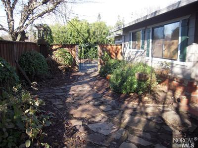 Flagstone entrance as seen from the backyard- landscaped and beautiful