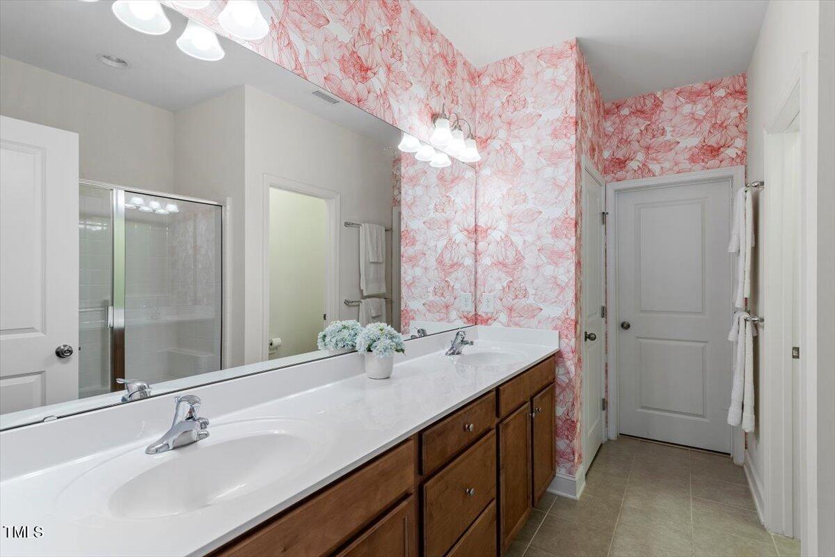225 Mayfield Drive Apex, NC 27539 - Photo 24 of 41 a bathroom with a double vanity sink mirror and double
