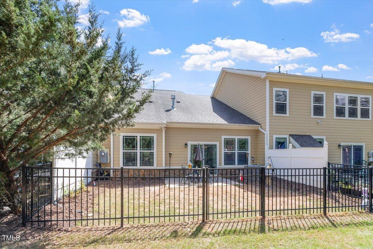 225 Mayfield Drive Apex, NC 27539 - Photo 32 of 41 a front view of a house with a iron fence