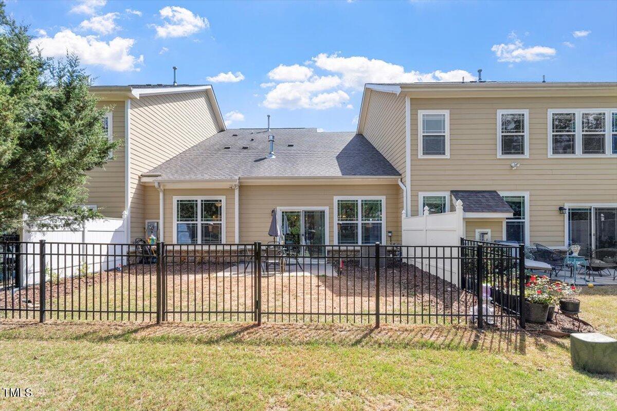 225 Mayfield Drive Apex, NC 27539 - Photo 35 of 41 a front view of a house with a iron fence
