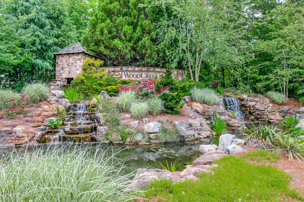 225 Mayfield Drive Apex, NC 27539 - Photo 36 of 41 a backyard of a house with a yard and outdoor seating