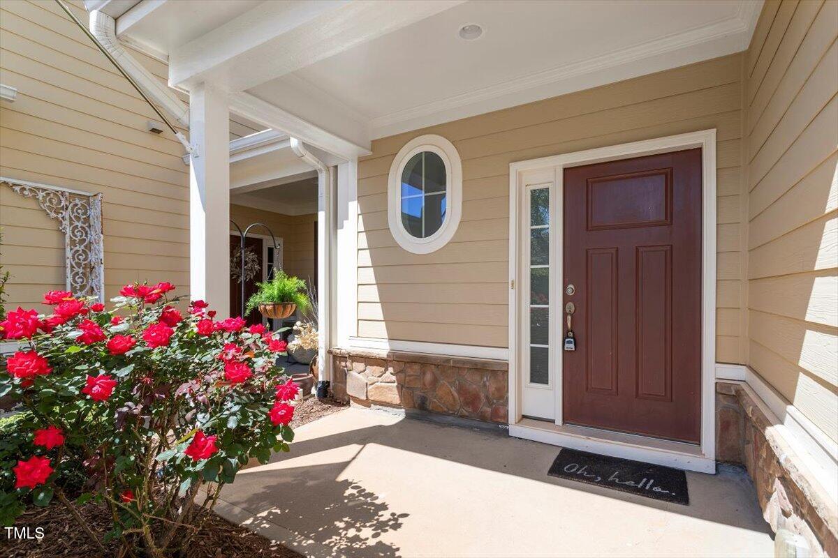 225 Mayfield Drive Apex, NC 27539 - Photo 5 of 41 a front view of house with flowers