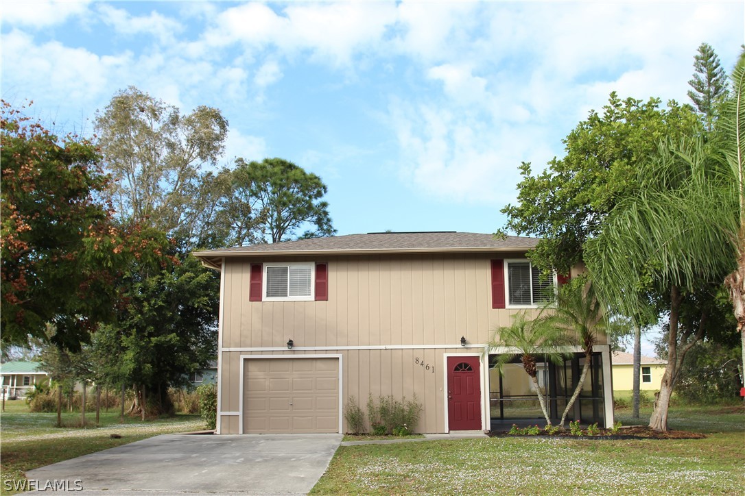 8461 Cardinal Road Fort Myers, FL 33967 - Photo 1 of 19 a view of a house with a backyard