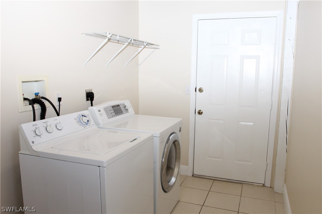 8461 Cardinal Road Fort Myers, FL 33967 - Photo 15 of 19 a utility room with dryer and washer