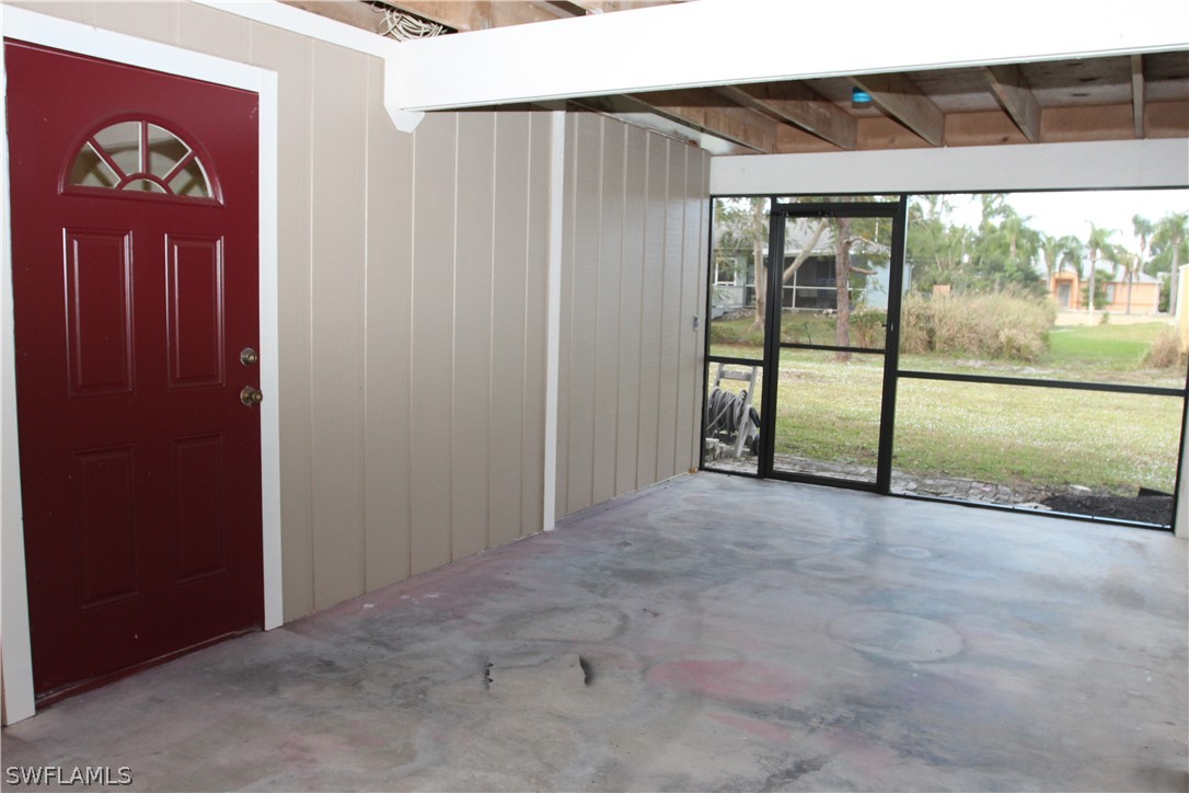 8461 Cardinal Road Fort Myers, FL 33967 - Photo 18 of 19 an empty room with sliding door and view of balcony