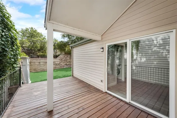 a view of a porch with wooden floor