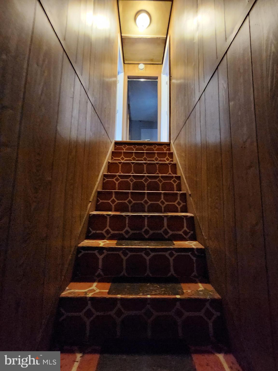 26552 Old State Road Crisfield, MD 21817 - Photo 8 of 26 Main stairs to second floor.