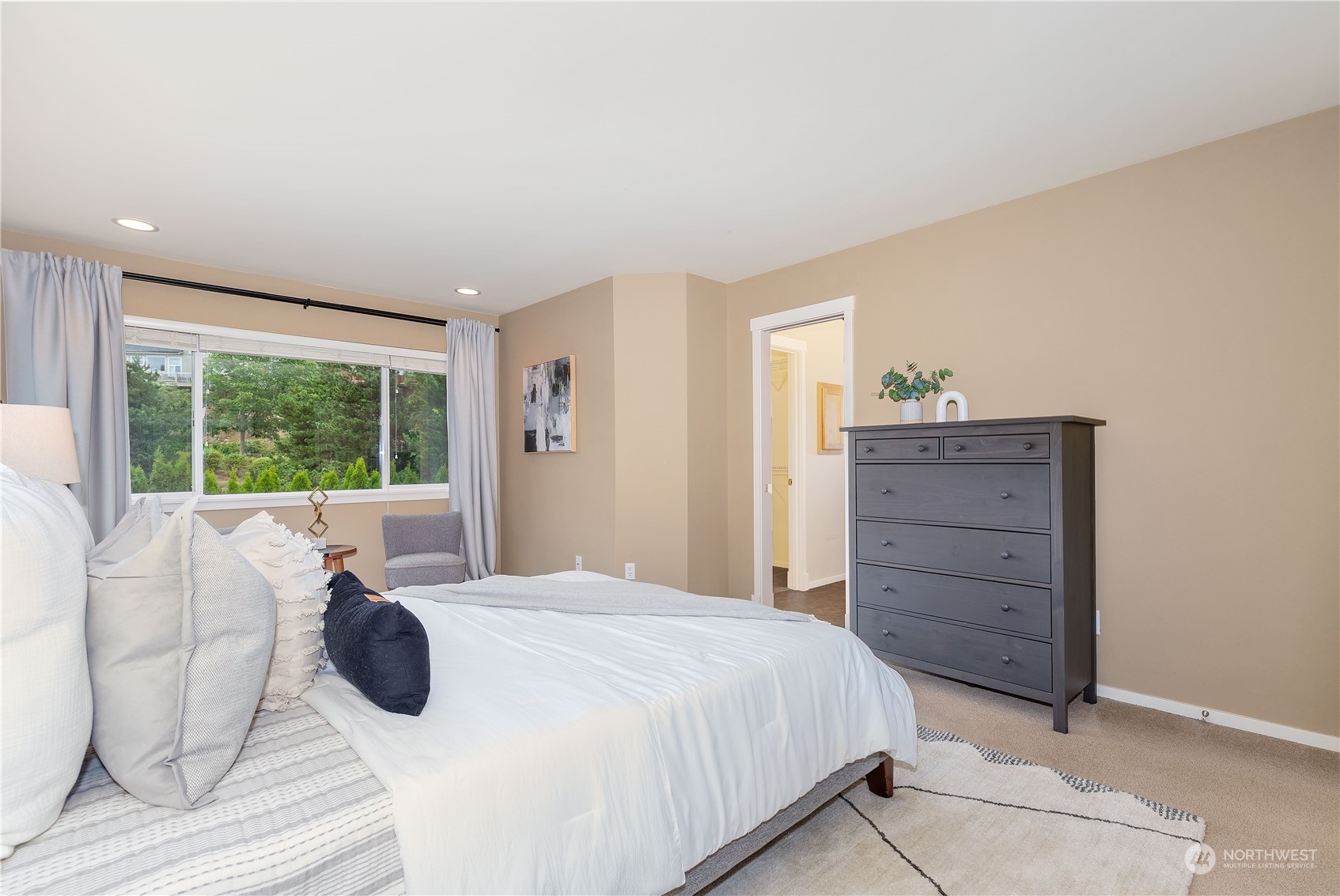 16722 166th Place Southeast Renton, WA 98058 - Photo 17 of 35 a bedroom with a bed and a dresser