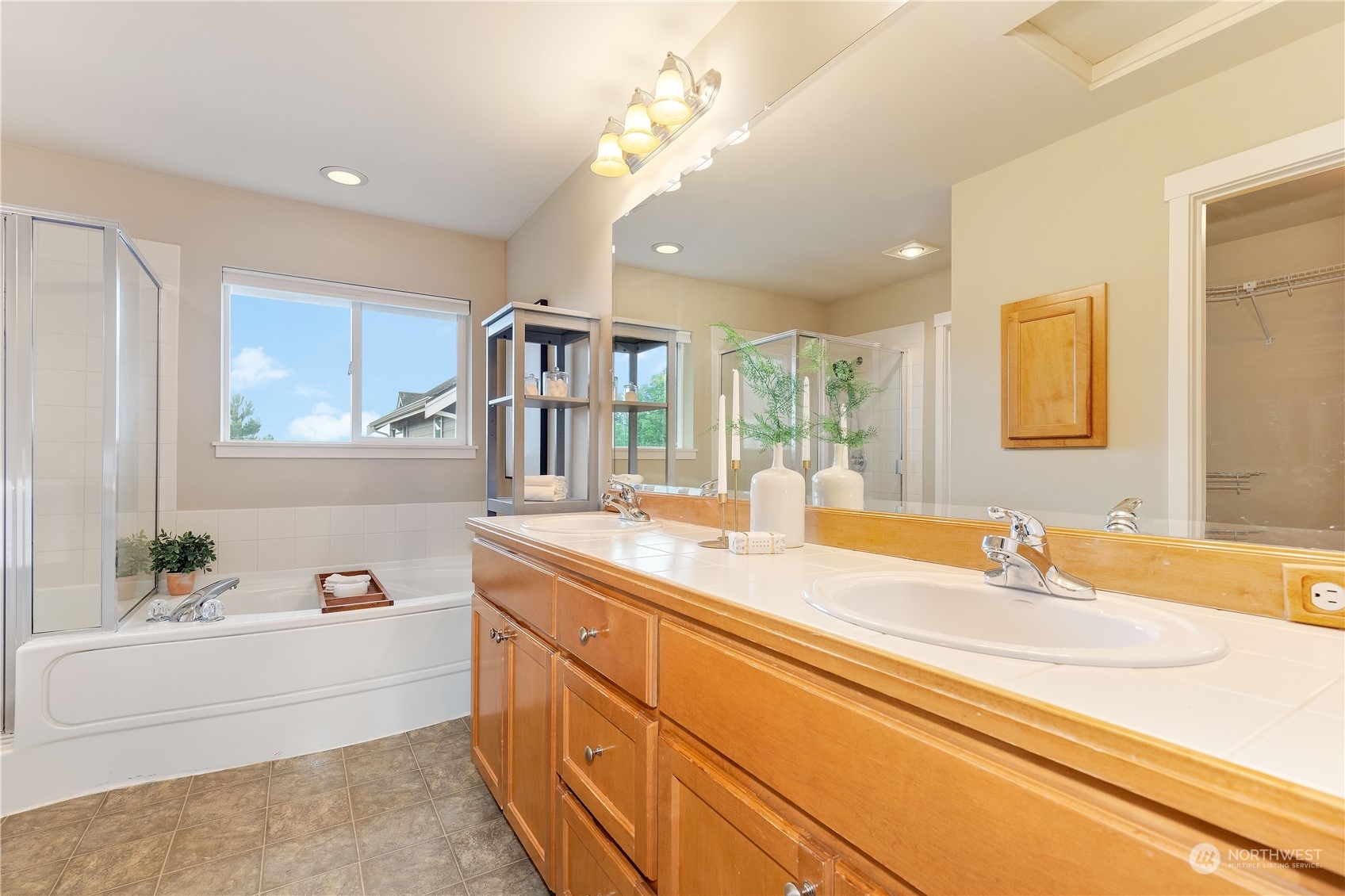 16722 166th Place Southeast Renton, WA 98058 - Photo 19 of 35 a bathroom with a tub sink and mirror