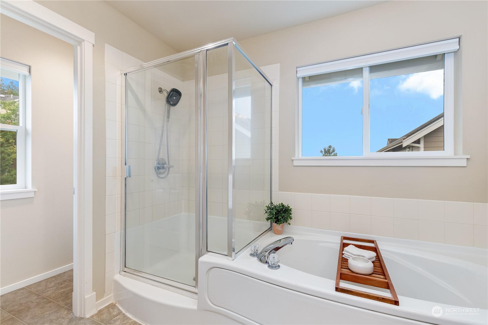 16722 166th Place Southeast Renton, WA 98058 - Photo 20 of 35 a bathroom with a tub and a shower
