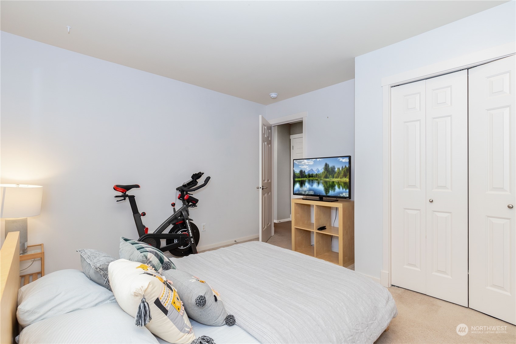 16722 166th Place Southeast Renton, WA 98058 - Photo 23 of 35 a bedroom with furniture and a wooden floor