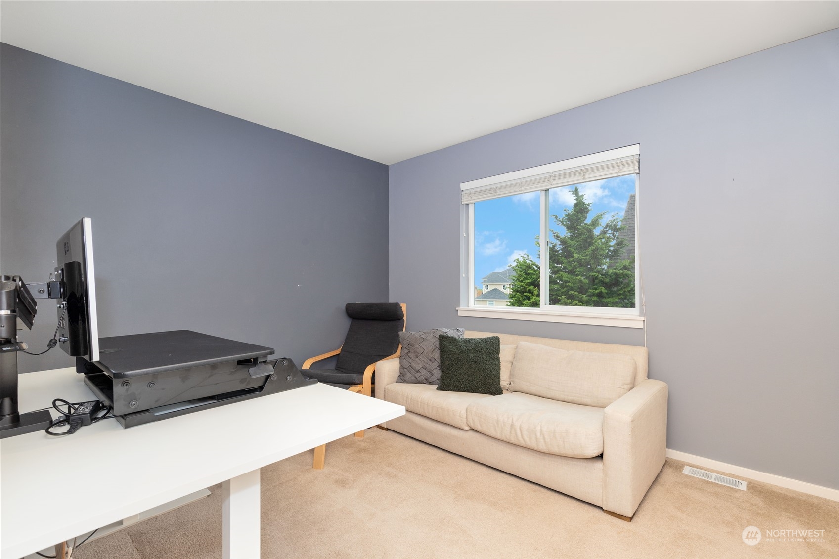 16722 166th Place Southeast Renton, WA 98058 - Photo 25 of 35 a living room with a bed furniture and a window
