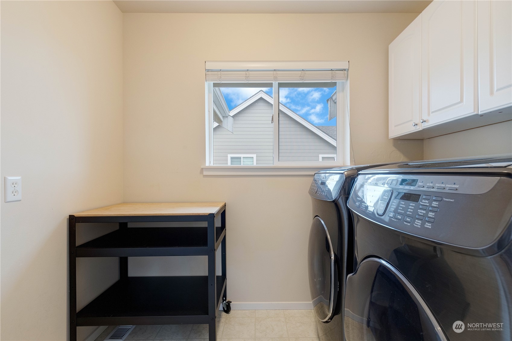 16722 166th Place Southeast Renton, WA 98058 - Photo 30 of 35 a room with a table and a window