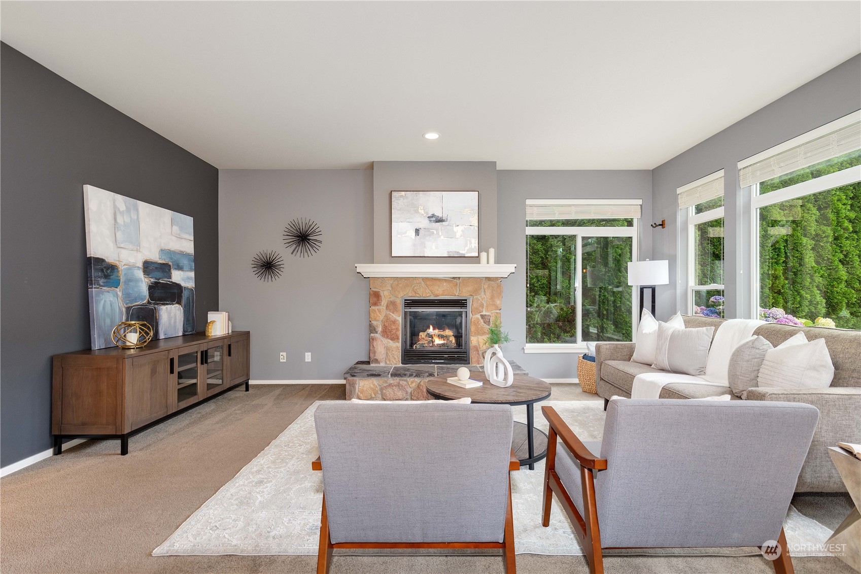 16722 166th Place Southeast Renton, WA 98058 - Photo 3 of 35 a living room with furniture a fireplace and a large window
