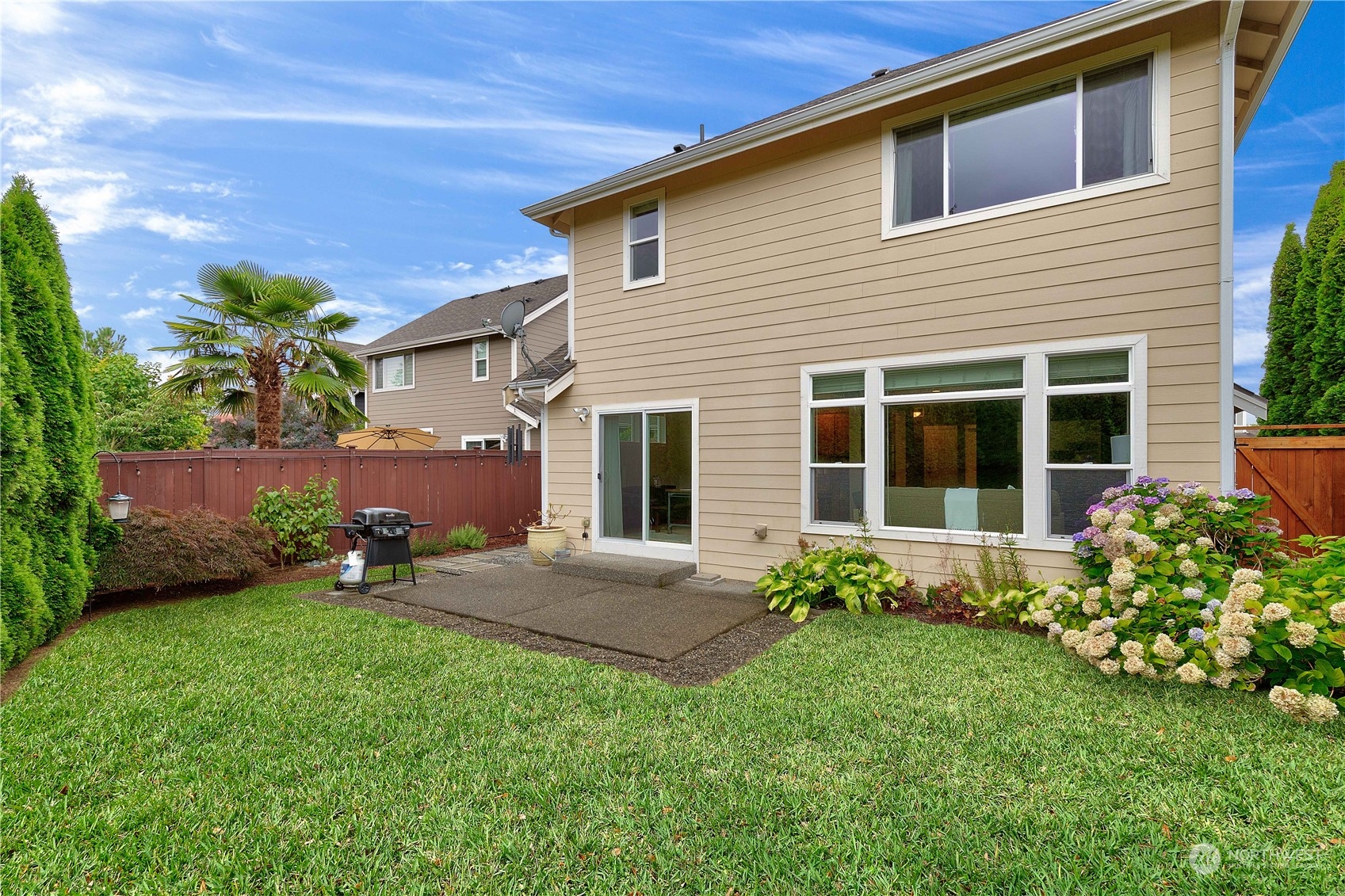 16722 166th Place Southeast Renton, WA 98058 - Photo 31 of 35 a front view of a house with garden
