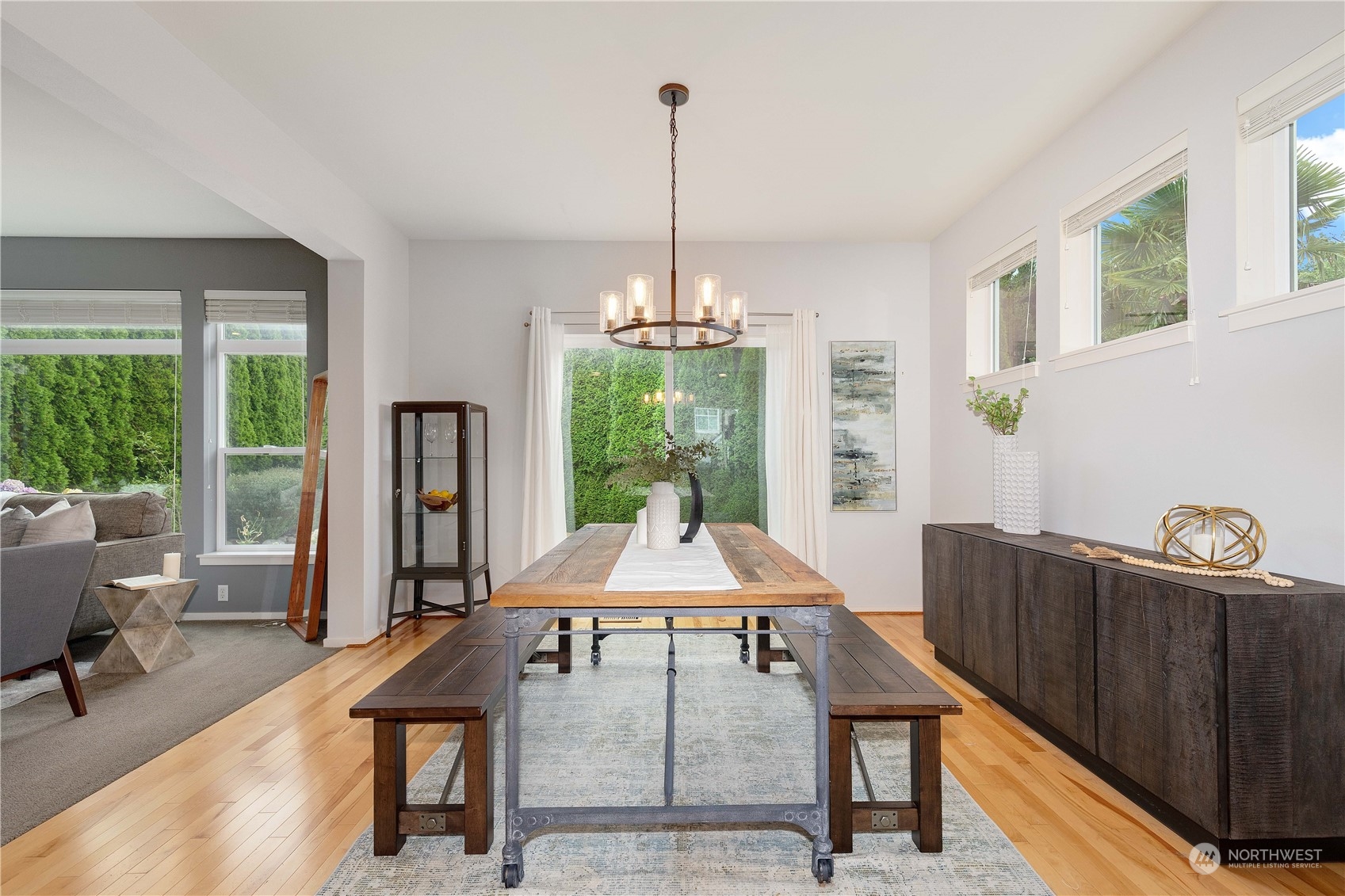 16722 166th Place Southeast Renton, WA 98058 - Photo 6 of 35 a view of a dining room with furniture window and wooden floor