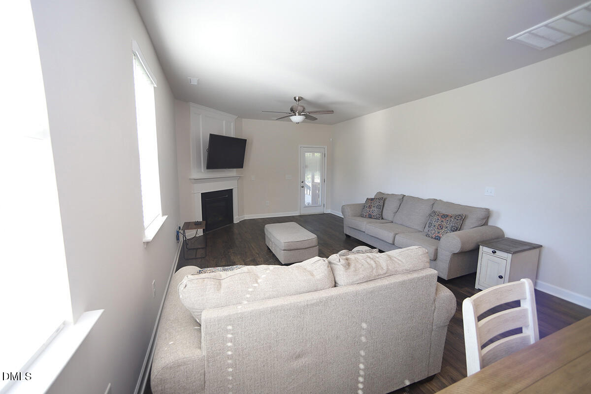 125 Mae Court Roxboro, NC 27573 - Photo 11 of 30 a living room with furniture and a flat screen tv