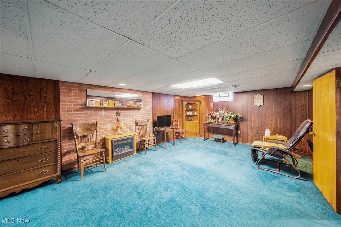 30888 Harrison Road Wickliffe, OH 44092 - Photo 24 of 33 Sitting room with carpet floors, a drop ceiling, and wood walls
