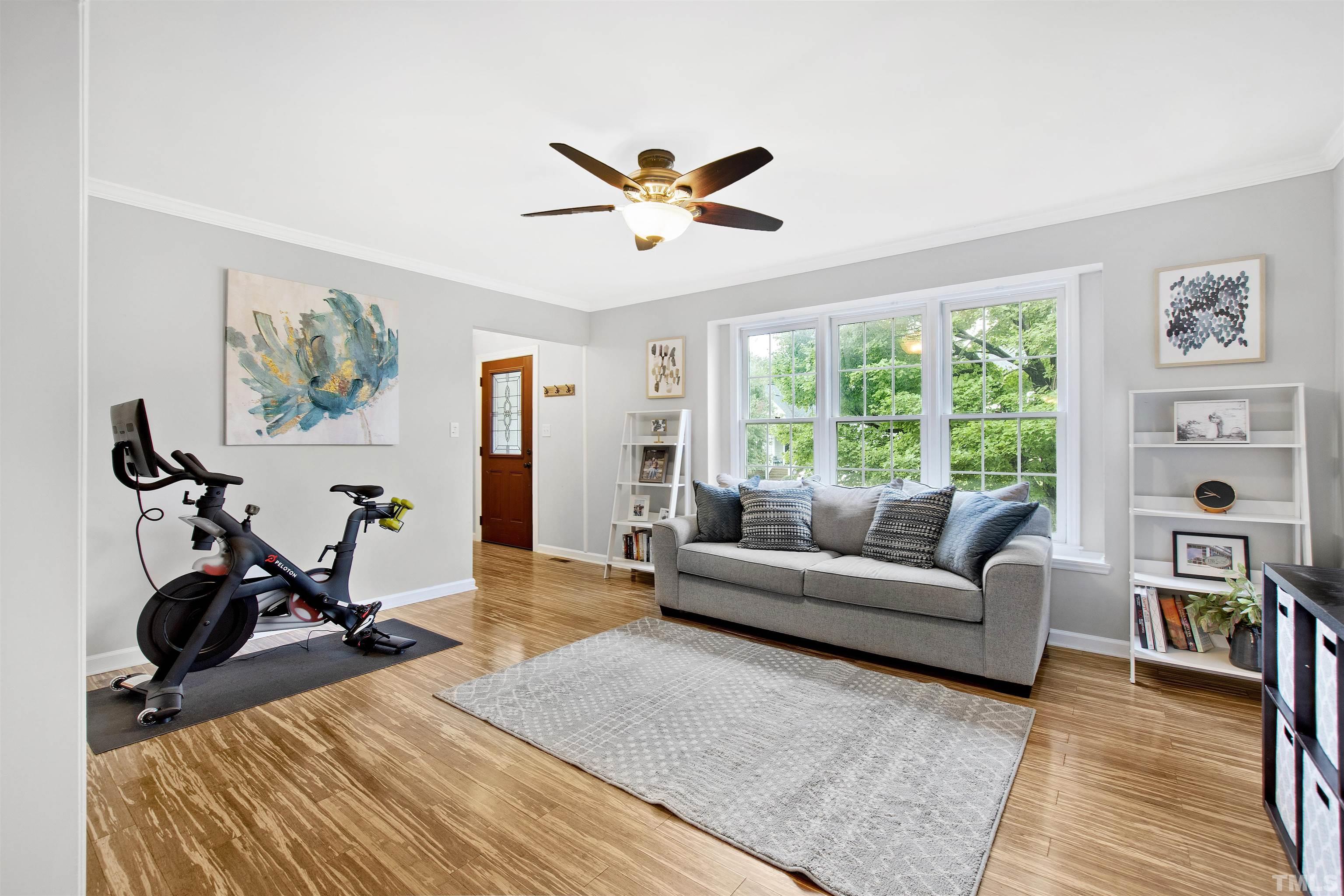2309 Declaration Drive Raleigh, NC 27615 - Photo 2 of 30 a living room with furniture a window and a flat screen tv