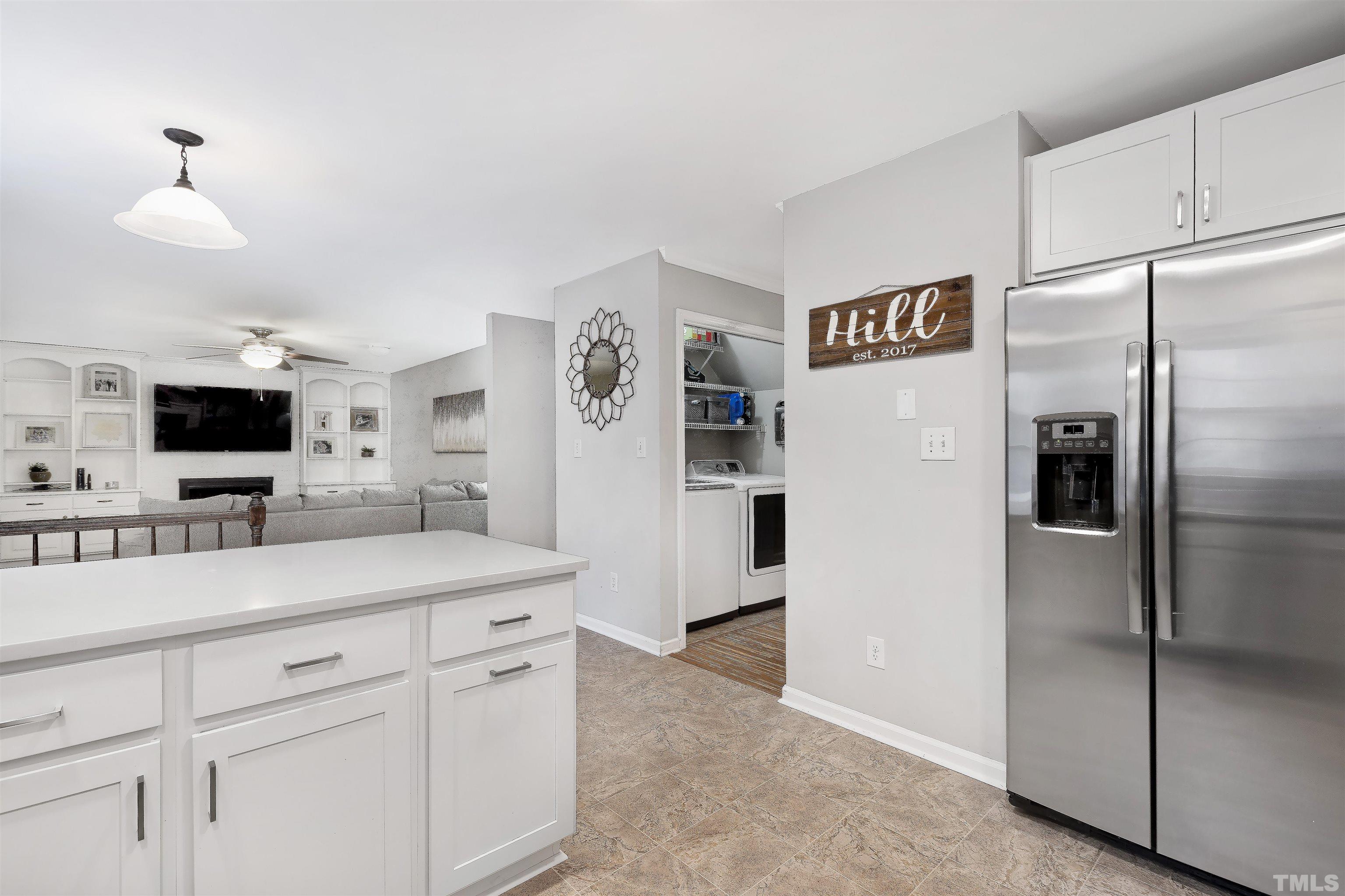 2309 Declaration Drive Raleigh, NC 27615 - Photo 14 of 30 a spacious kitchen with stainless steel appliances a refrigerator and a sink