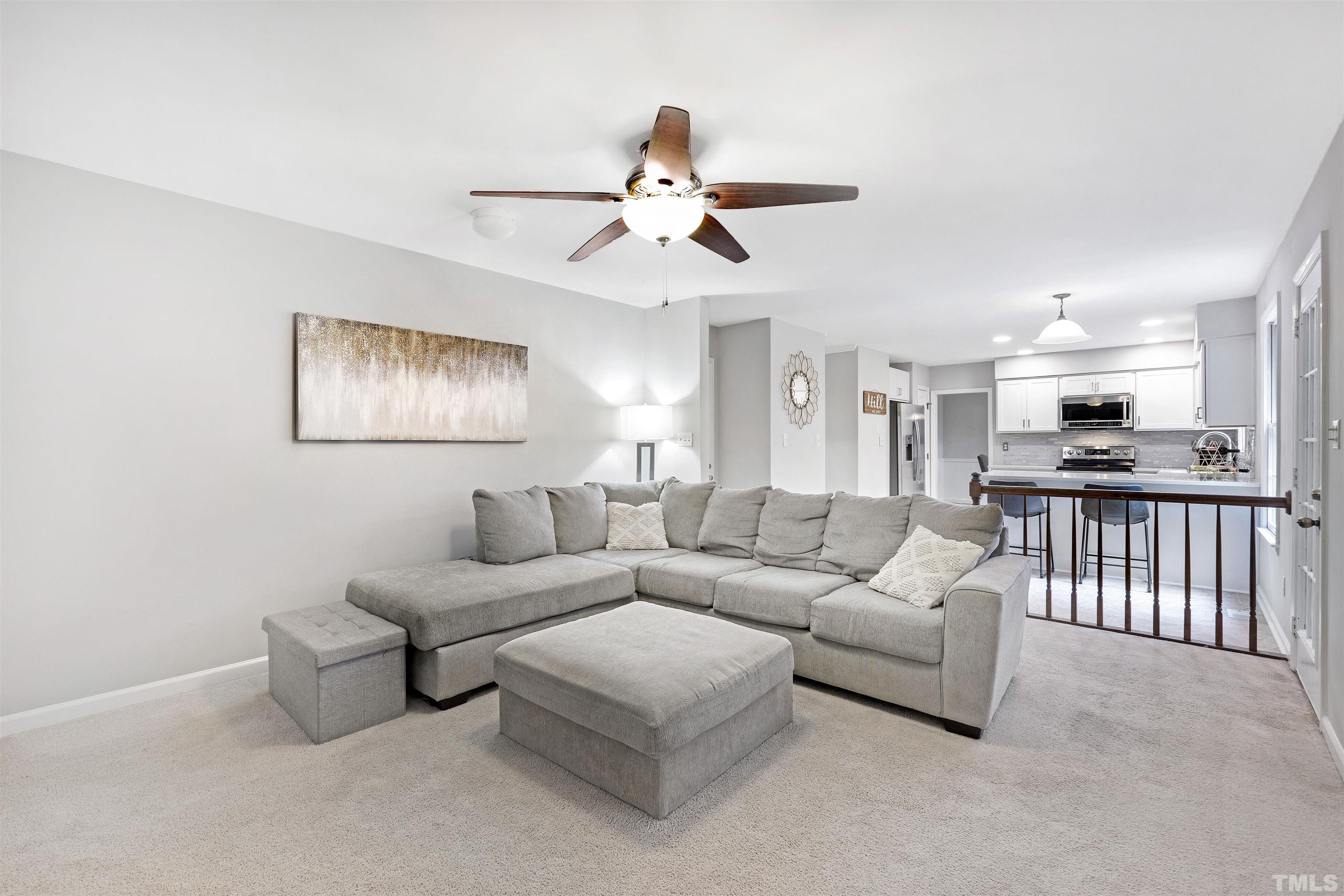 2309 Declaration Drive Raleigh, NC 27615 - Photo 16 of 30 a living room with furniture and kitchen view