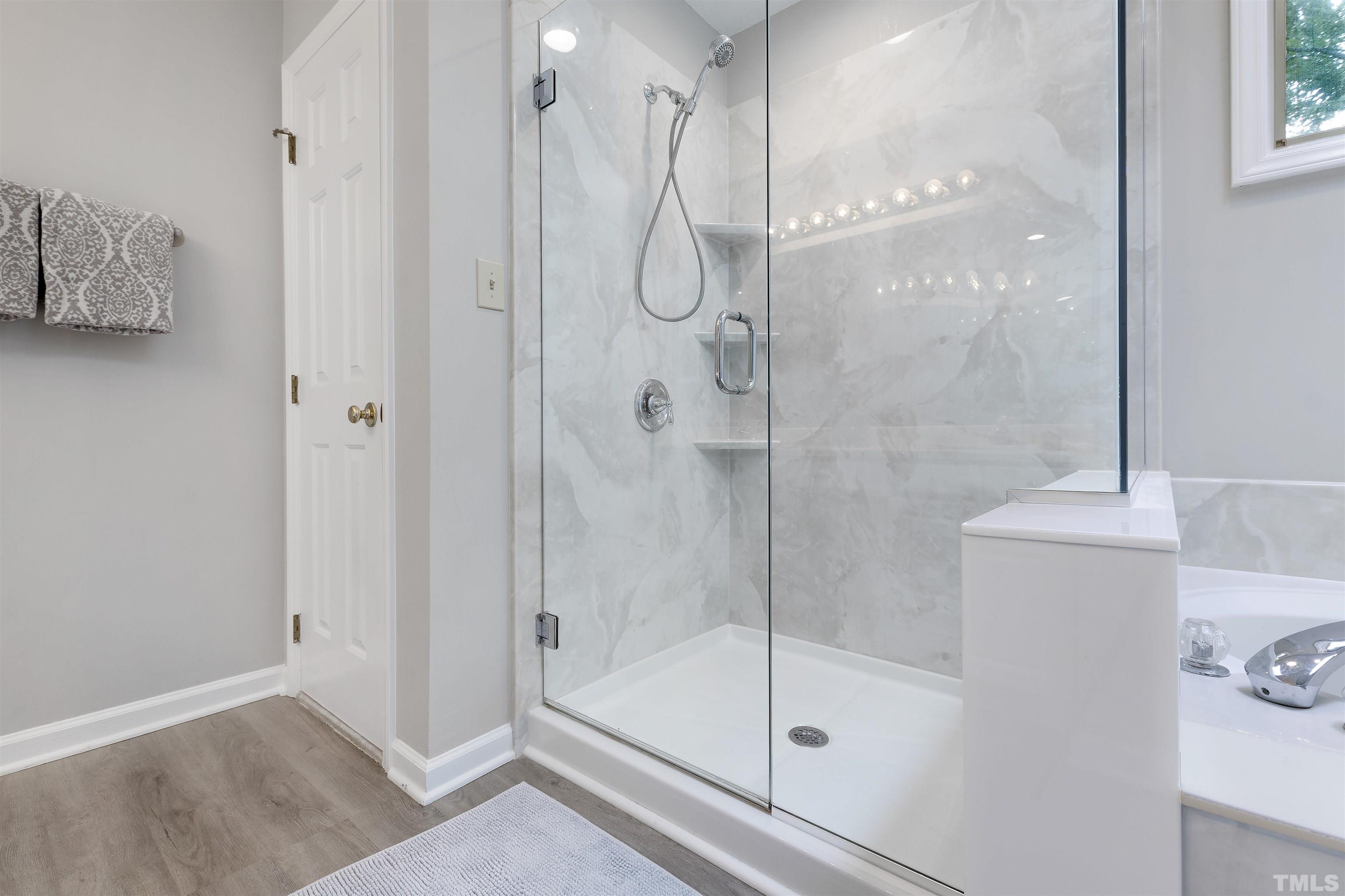 2309 Declaration Drive Raleigh, NC 27615 - Photo 18 of 30 a bathroom with a glass shower door