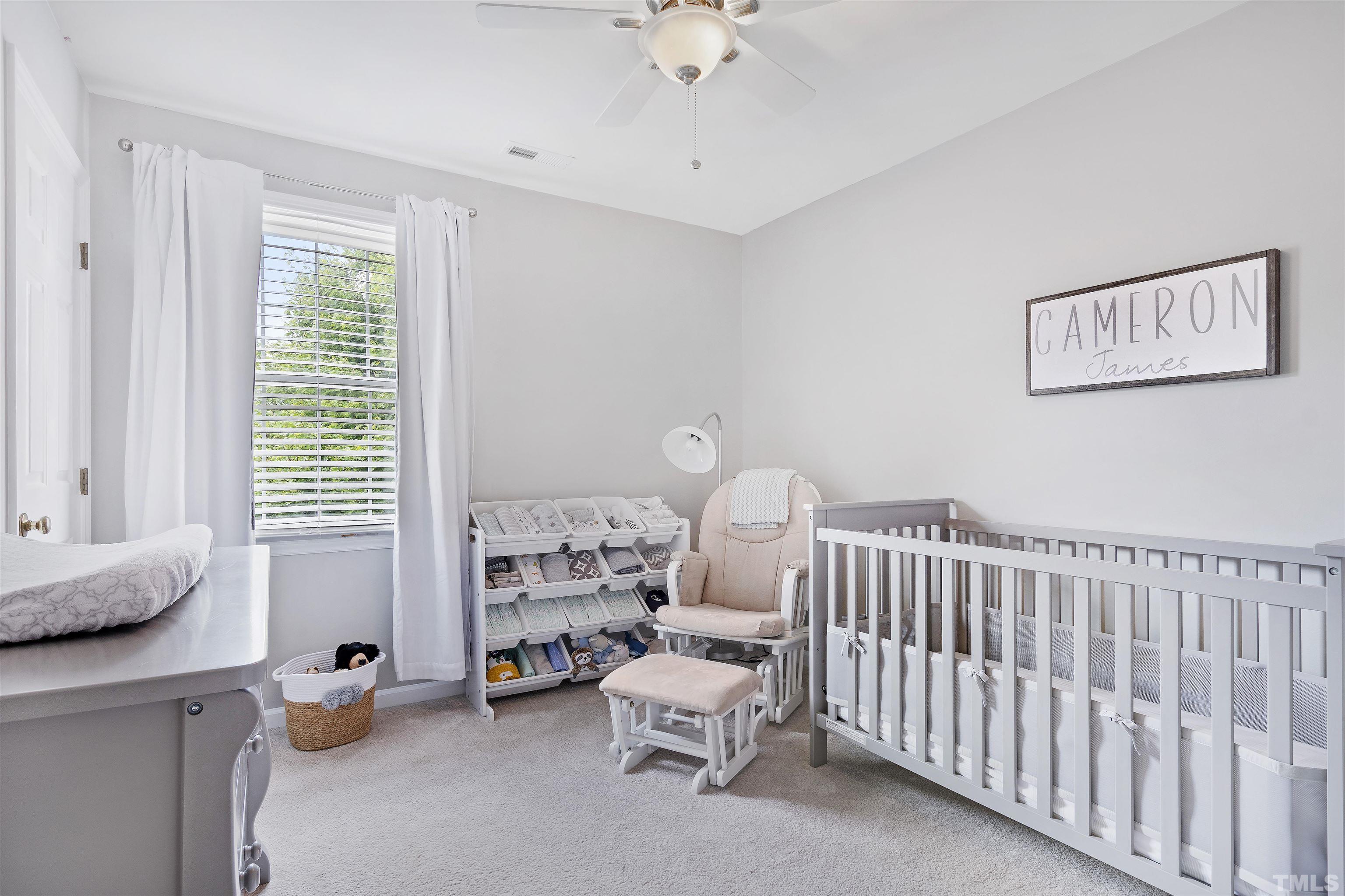 2309 Declaration Drive Raleigh, NC 27615 - Photo 22 of 30 a bedroom with furniture and a window