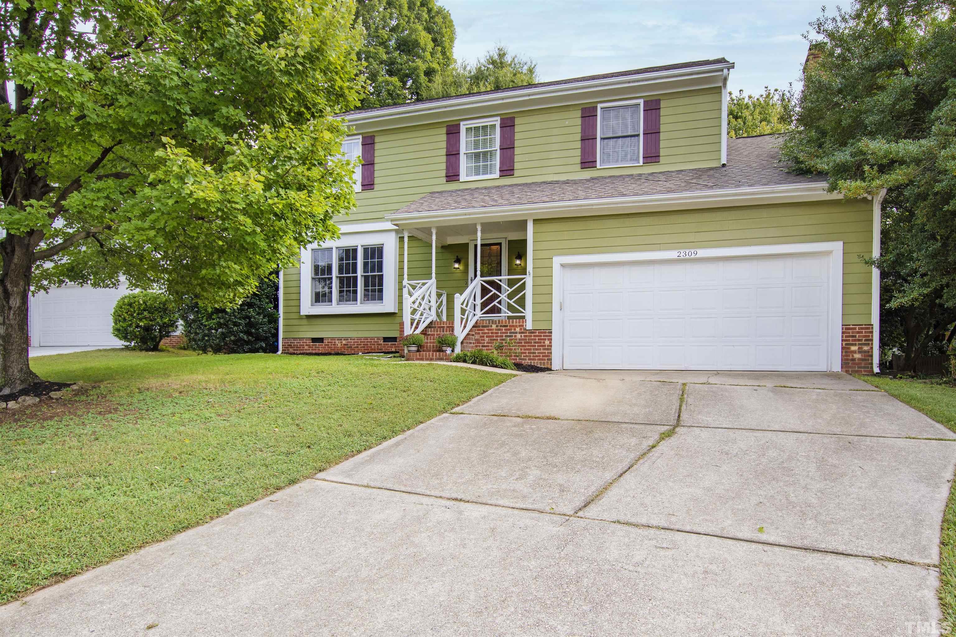 2309 Declaration Drive Raleigh, NC 27615 - Photo 7 of 30 a front view of a house with garden