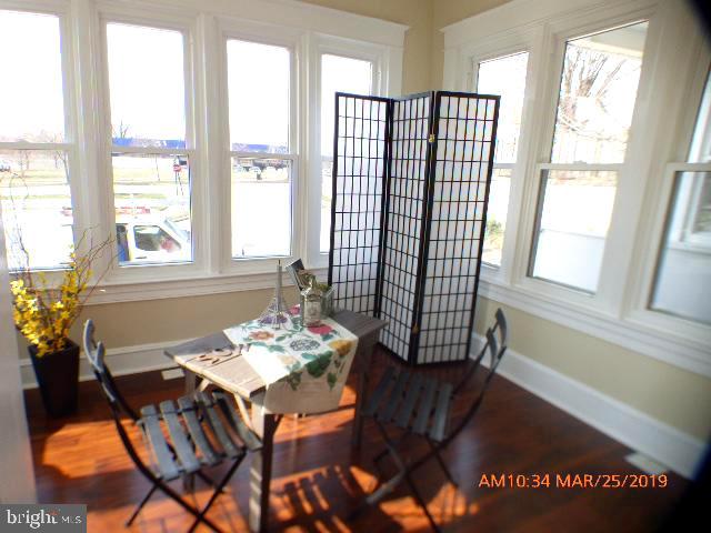 3102 Cedarhurst Road Baltimore, MD 21214 - Photo 2 of 42 a dining room with furniture and window