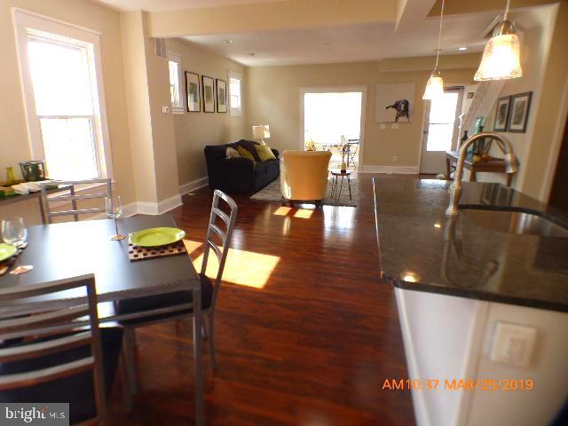3102 Cedarhurst Road Baltimore, MD 21214 - Photo 12 of 42 a view of living room with furniture and wooden floor