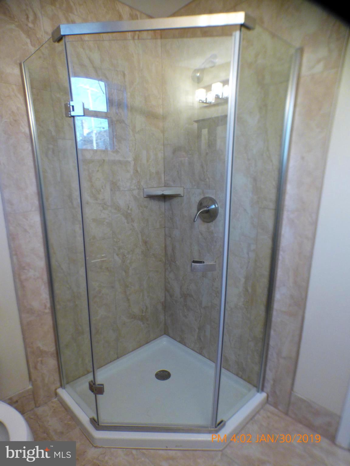3102 Cedarhurst Road Baltimore, MD 21214 - Photo 19 of 42 a bathroom with a shower