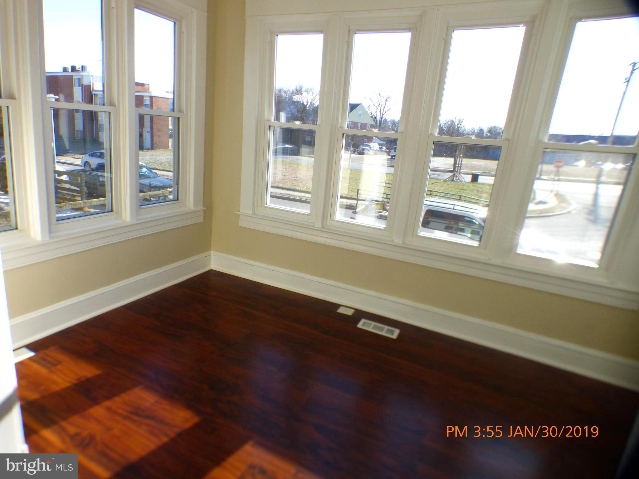 3102 Cedarhurst Road Baltimore, MD 21214 - Photo 3 of 42 a view of an empty room with a window