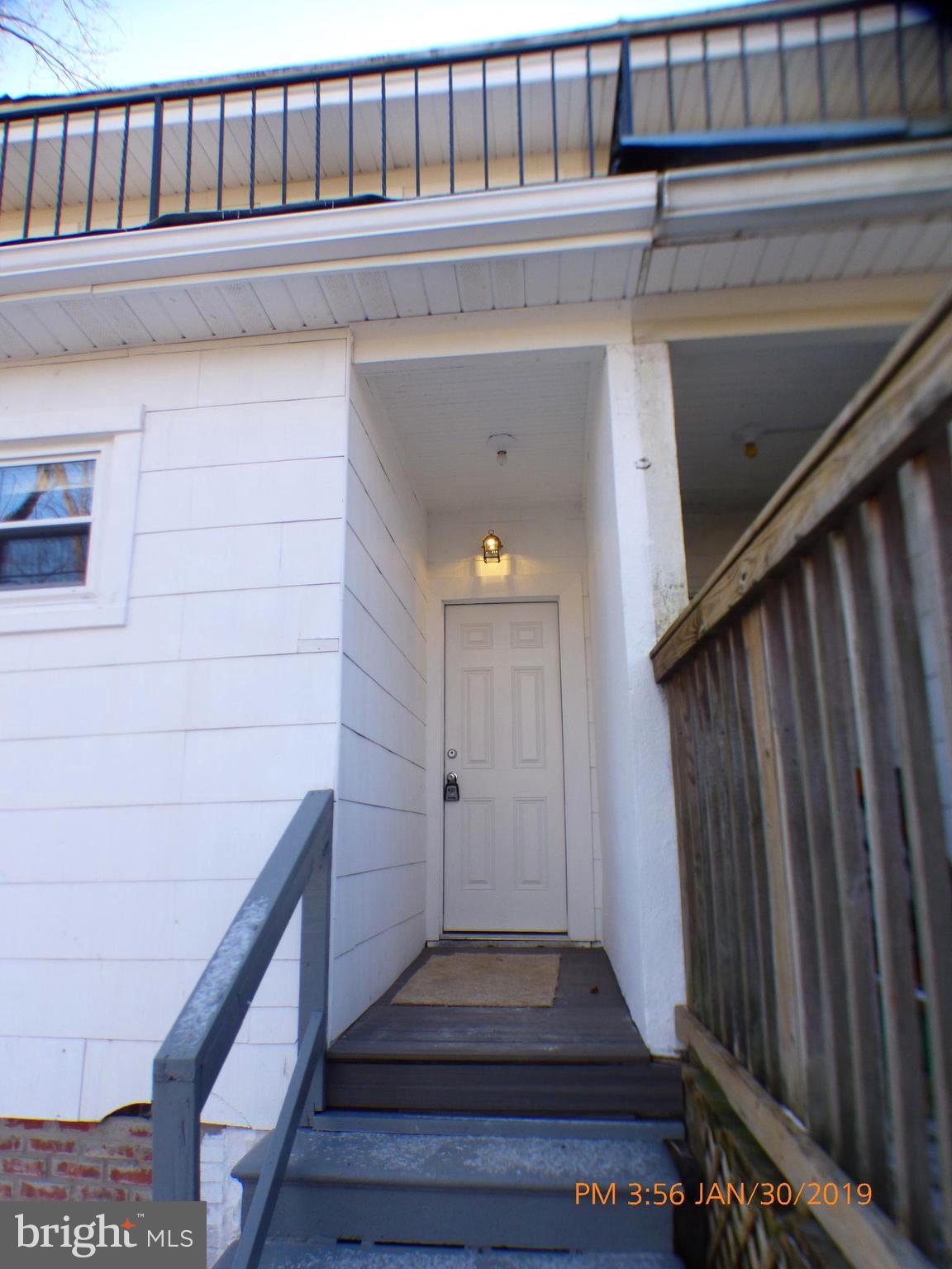 3102 Cedarhurst Road Baltimore, MD 21214 - Photo 26 of 42 a view of entryway with wooden floor