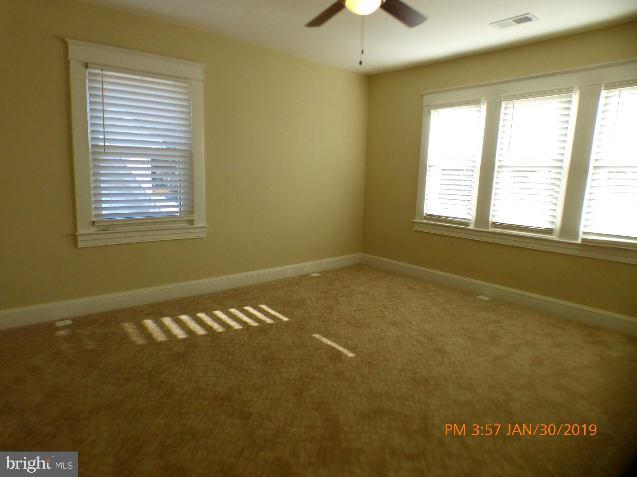 3102 Cedarhurst Road Baltimore, MD 21214 - Photo 28 of 42 a view of an empty room with a window