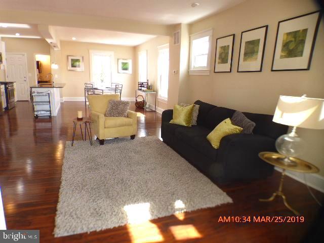 3102 Cedarhurst Road Baltimore, MD 21214 - Photo 4 of 42 a living room with furniture flowerpot and a table