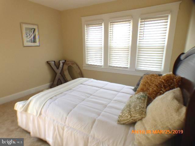 3102 Cedarhurst Road Baltimore, MD 21214 - Photo 33 of 42 a bedroom with a bed and a window