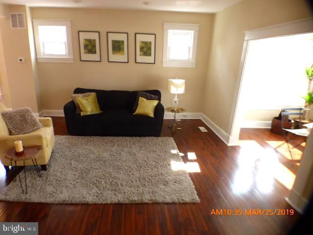 3102 Cedarhurst Road Baltimore, MD 21214 - Photo 6 of 42 a living room with furniture and a couch