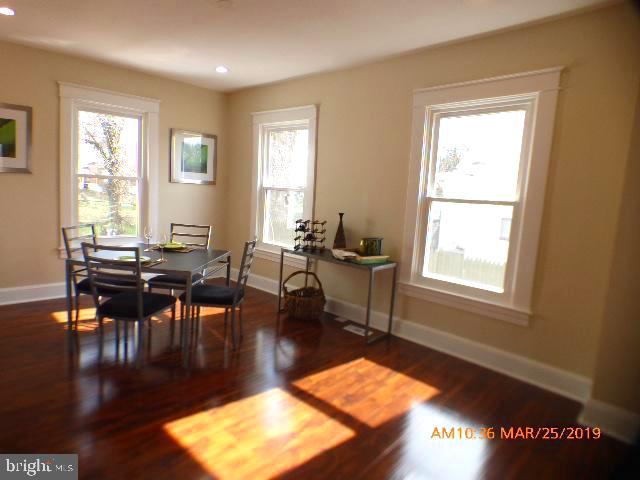 3102 Cedarhurst Road Baltimore, MD 21214 - Photo 8 of 42 a living room with furniture pool table and a window