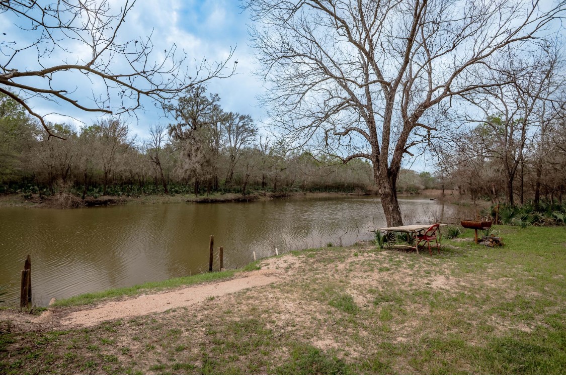 Lot 1-and Harper Branch Road Trinity, TX 75862 - Photo 12 of 21 a backyard of a house with lots of green space and lake view