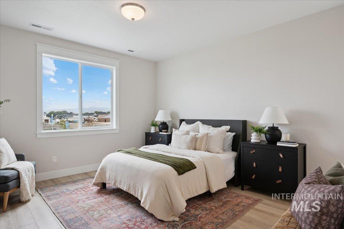 6271 West Snow Currant Street Meridian, ID 83646 - Photo 9 of 14 Bedroom with light wood-style floors
