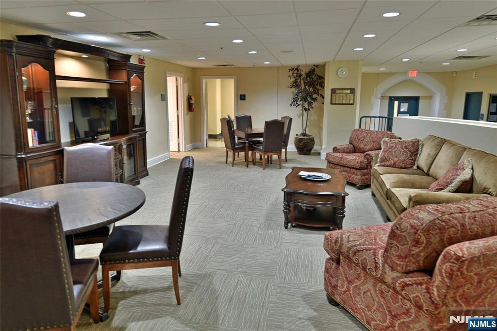 4201 Rio Vista Drive, Unit 4201 Mahwah, NJ 07430 - Photo 28 of 34 a living room with furniture and wooden floor