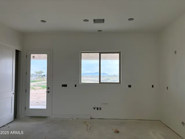 a kitchen with a stove and a refrigerator