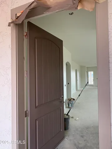 a kitchen with kitchen island granite countertop a sink stove microwave and cabinets