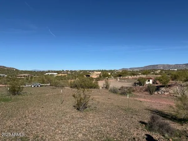 a view of an ocean beach and mountain