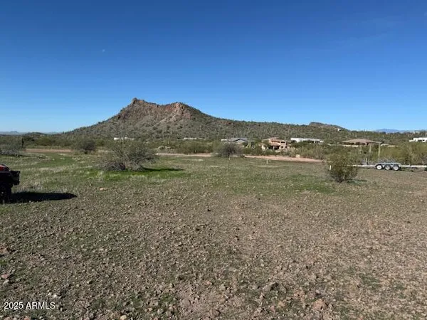 a view of a town with mountains in the background