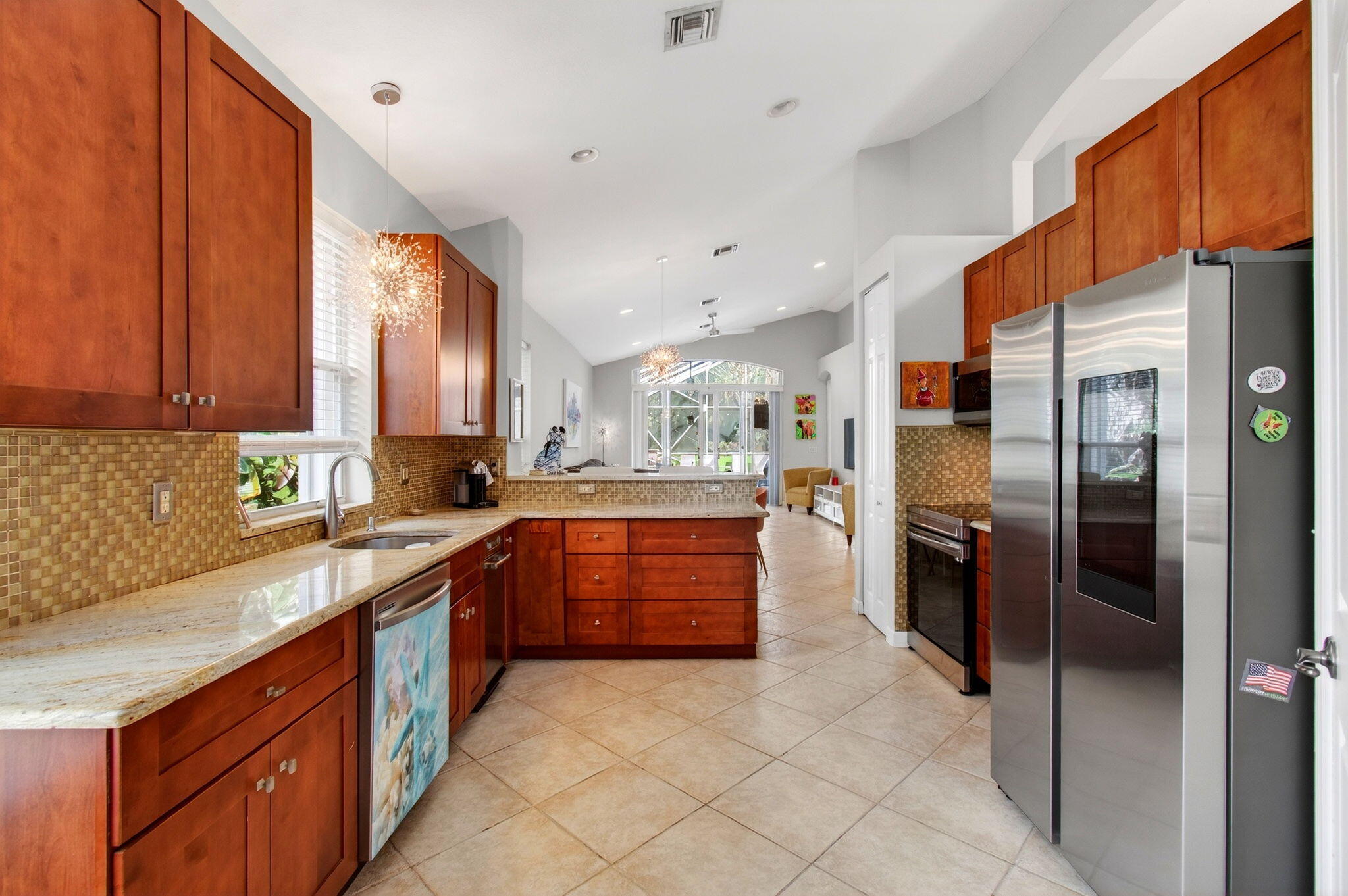 6737 Southport Drive Boynton Beach, FL 33472 - Photo 34 of 99 a kitchen with stainless steel appliances granite countertop a refrigerator and a sink