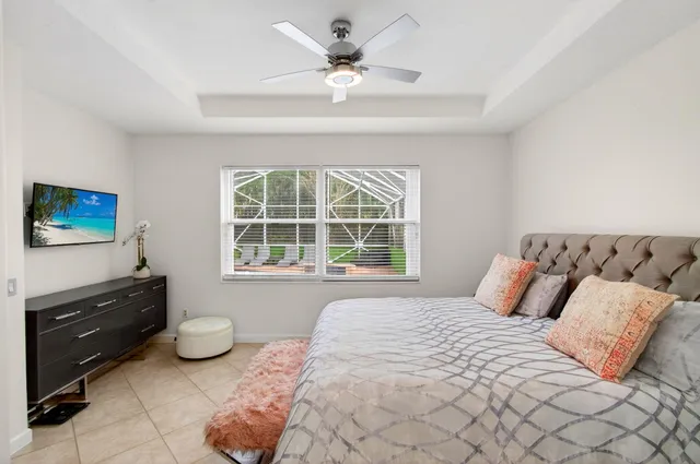 an aerial view of a house with yard swimming pool and outdoor seating