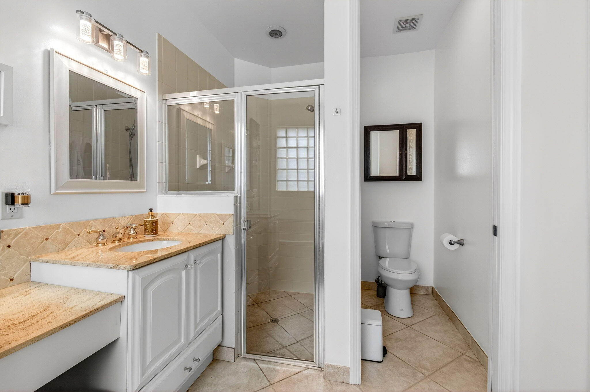6737 Southport Drive Boynton Beach, FL 33472 - Photo 49 of 99 a bathroom with a granite countertop sink toilet and shower