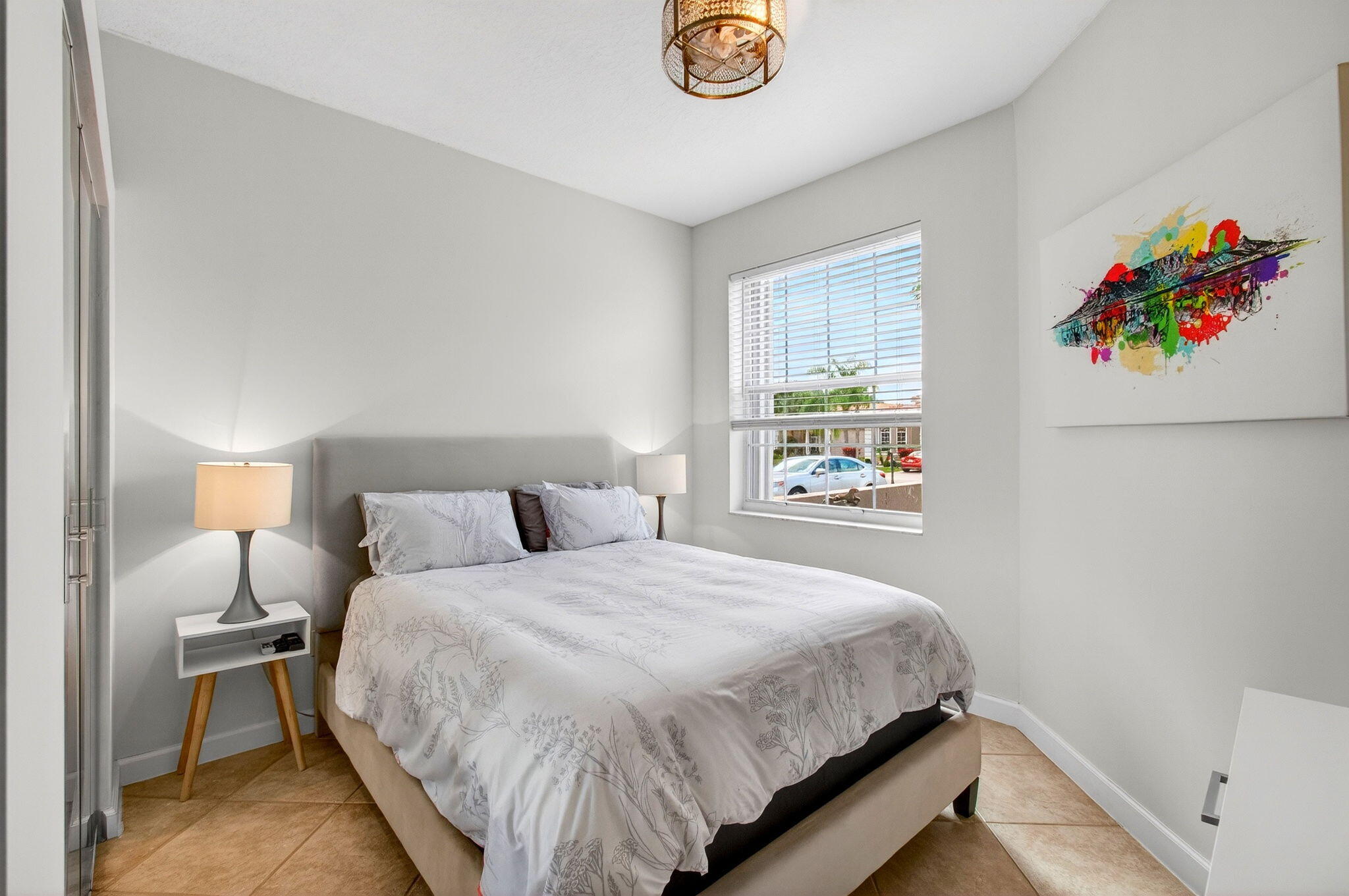 6737 Southport Drive Boynton Beach, FL 33472 - Photo 50 of 99 a bedroom with a bed and a painting on the wall