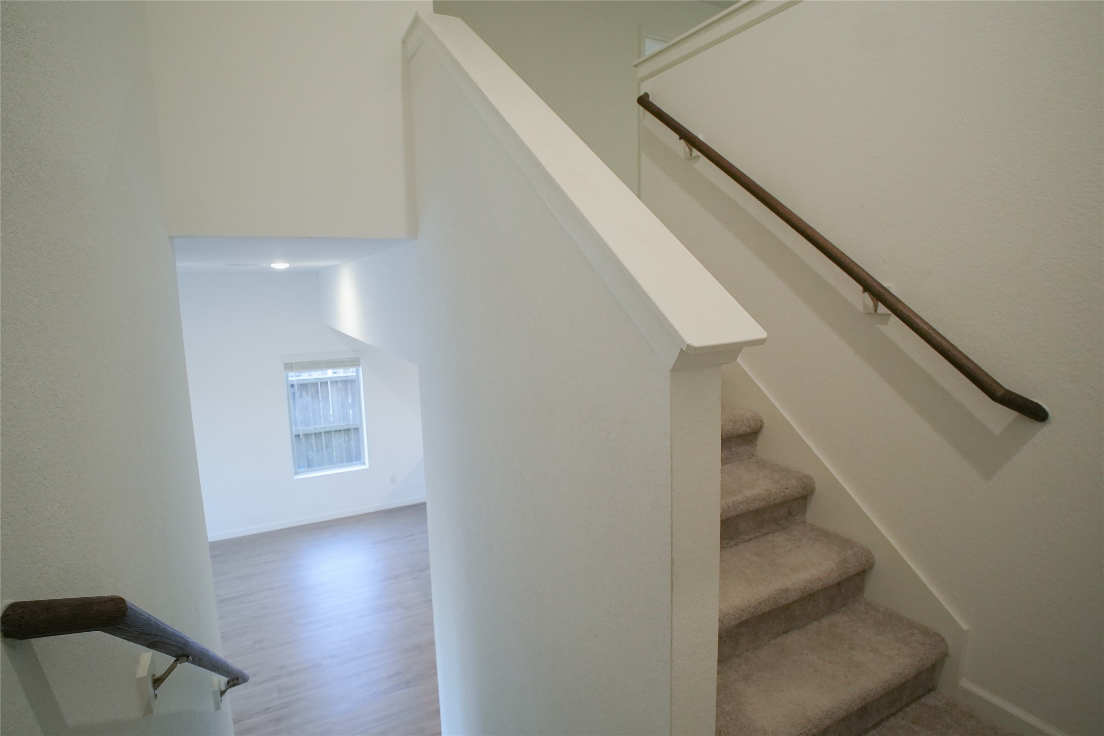 3210 Spanish Oak Lane Rosenberg, TX 77471 - Photo 17 of 29 a view of entryway and hall with wooden floor